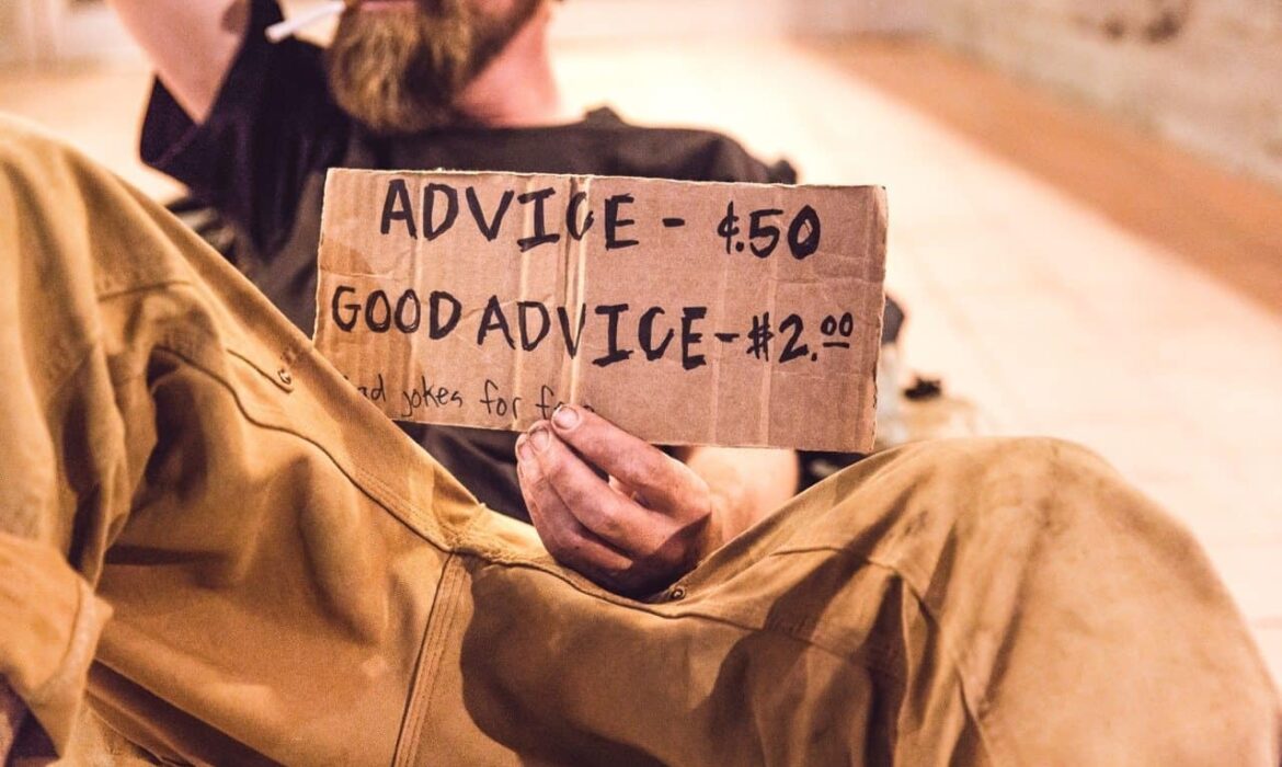 Picture of a homeless man advertising in a downturn