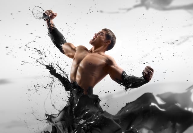 picture of a strong man in a pool of oil breaking free, to illustrate an oil and gas rockstar section