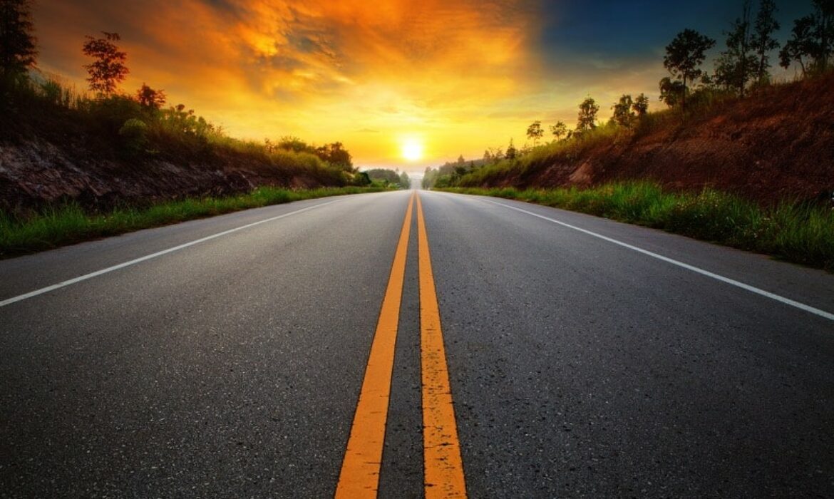 Road leading towards a beautiful sunrise for Online Marketing Services for Alternative Energy Companies post