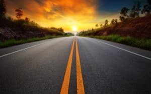 Road leading towards a beautiful sunrise for Online Marketing Services for Alternative Energy Companies post