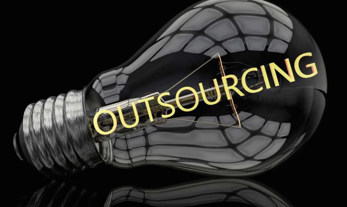 A lightbulb with the filament spelling Outsourcing for an outsourcing definition article
