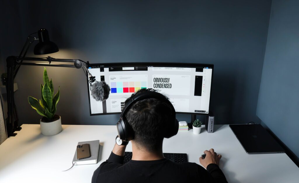 a freelancer working at his desk in front of a monitor